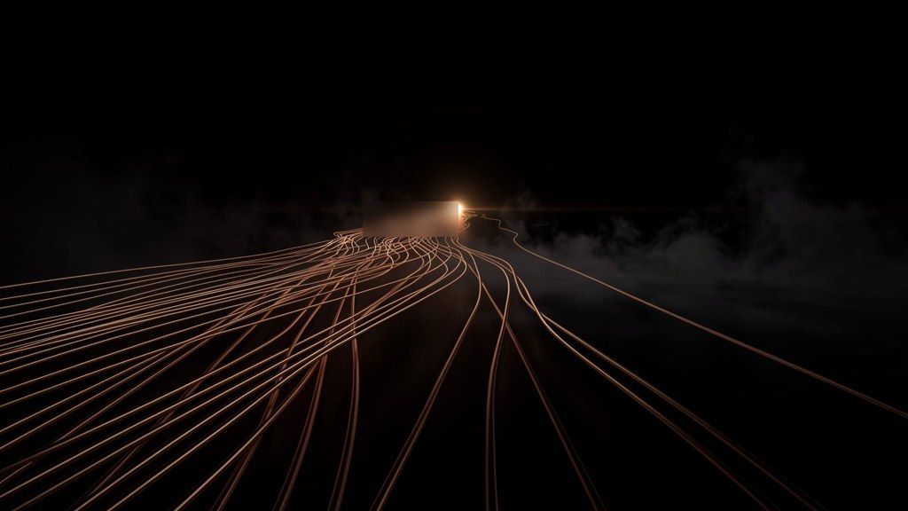 Parallel copper light trails converging in darkness